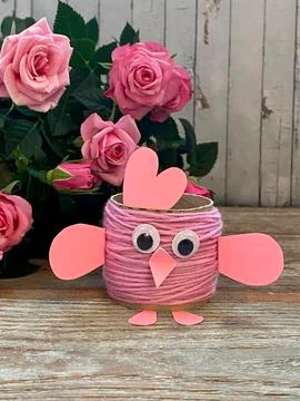 Pink chicken from yarn and processing-Easter egg stand, children's creative. Stock Photos