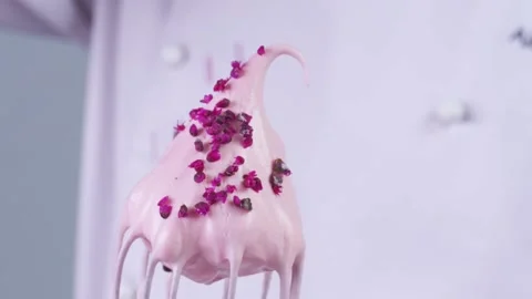 Pink chips are falling on cream cheese. Stock Footage 130852209