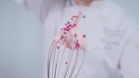Pink chips are falling on cream cheese. Stock Footage 141712020