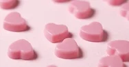 Pink Chocolate Candy On Pink Background Stock Footage