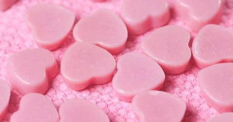 Pink chocolate candy on pink background Stock Footage 84809359