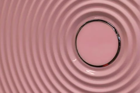 Pink Circular Wave Pattern with Metallic Center Stock Photos