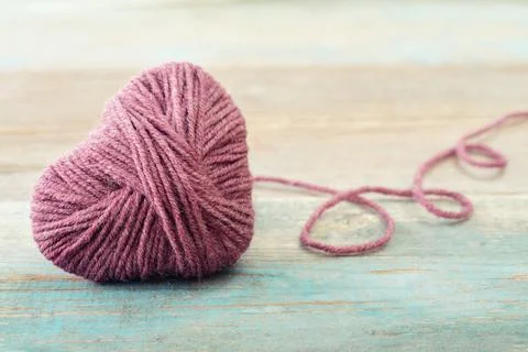 Pink clew in shape of heart Stock Photos