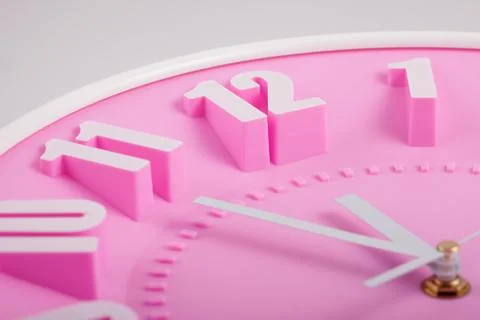 Pink clock face or dial closeup Stock Photos