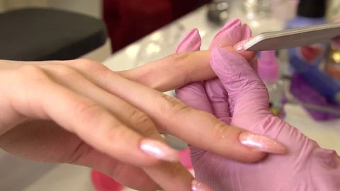 With pink Close Up View, slow motion. Female hands manicure close-up view. Aged Stock Footage 122636728