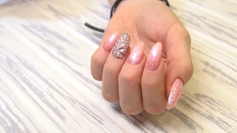 With pink Close Up View, slow motion Female hands manicure close up view Stock Footage 122646057