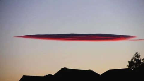 Pink cloud shaped like an alien spaceship Video stock 168171599