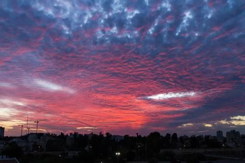Pink clouds in the blue sky. Stock Photos