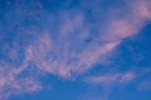 Pink Clouds in a Blue Sky Foto stock