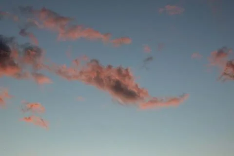 Pink Clouds in Blue Sky at Sunset 写真素材