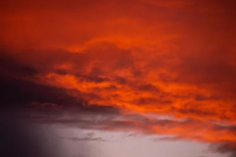 Pink clouds close up at sunset in the evening Stock Photos