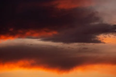 Pink clouds close up at sunset in the evening Stock Photos