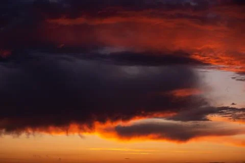 Pink clouds close up at sunset in the evening Stock Photos