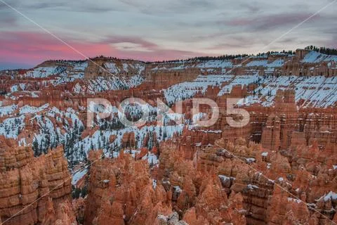 Pink Clouds Emerge Over Hoodoos in Bryce Stock Photos