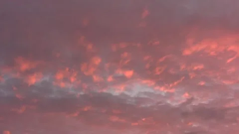 Pink clouds in eve. sky texture very slow pan right Stock Footage 292815324