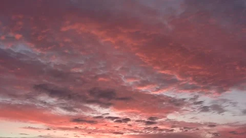 Pink clouds in evening pastel sky, very slow pan left Stock Footage 292815228
