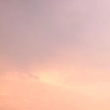 Pink clouds in the evening sky as a background. Stock Photos