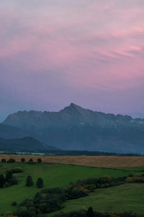 Pink clouds fading as sun sets. Stock Footage 254744730