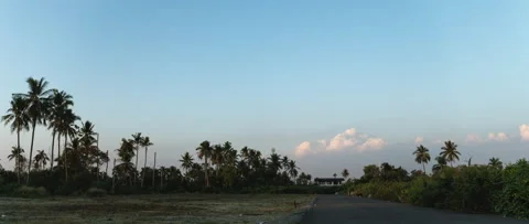 Pink clouds forming up above a house. Stock Footage 169132101