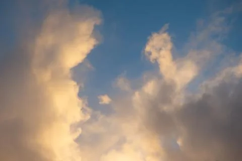 Pink clouds illuminated by the sun Stock Photos