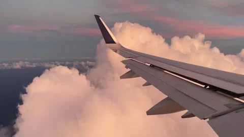 Pink clouds outside of Airplane window Stock-Footage 249787633