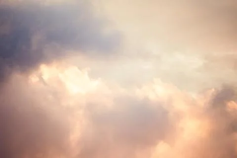Pink clouds in the sky. Evening sky texture. Stock Photos
