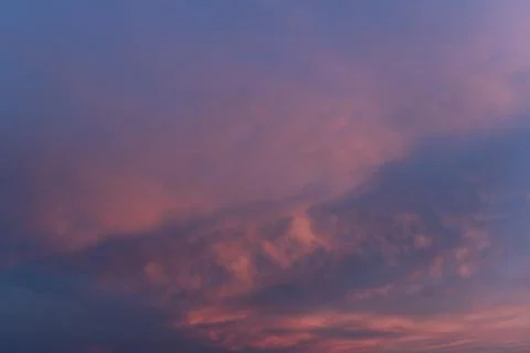 Pink clouds on the sky at sunset Stock Photos