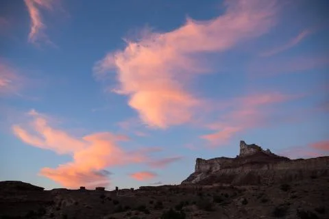 Pink clouds at sunset over Temple Mountain Stock Photos