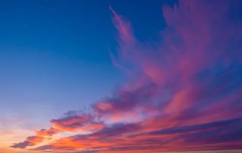 Pink clouds at a sunset Stock Photos