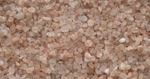 Pink coarse grain salt. Table spin. Stock Footage 279569932