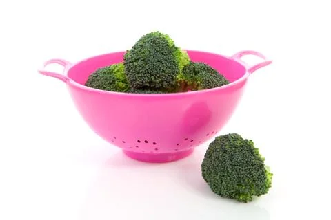 Pink colander with broccoli vegetable Stock Photos