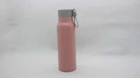 Pink colored bottle on white background Stock Photos