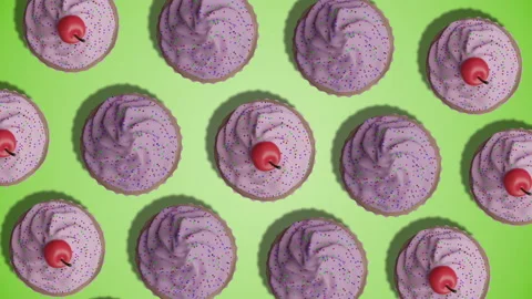 Pink colored cupcakes with cherry rotating against green background animation Stock Footage 197420129