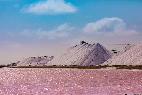 Pink colored ocean overlooking the Salt Pyramids of Bonaire, Netherlands Stock Photos