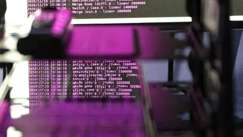 Pink computer software code moving on a black monitor reflect on glass. Abstr 스톡 동영상 143878619