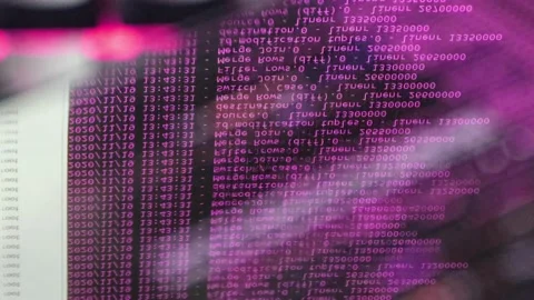 Pink computer software code moving on a black monitor reflect on glass. Abstr 스톡 동영상 144047208