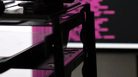 Pink computer software code moving on a black monitor reflect on glass. Abstr Stock Footage 144049694