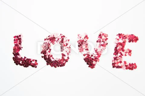 Pink confetti spelling out love Stock Photos