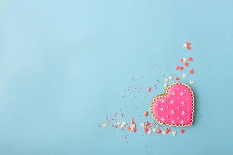 Pink cookie heart shaped with different patterns, blue background Stock Photos