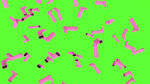 Pink cowboy boots fall from above like a playful fashion rain on a chromakey Stock Footage 340558640