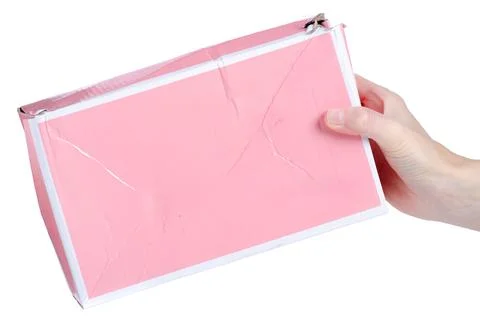 Pink crumpled box in hand Stock Photos
