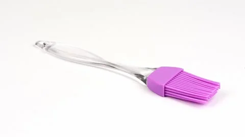 Pink culinary brush, kitchen utensil. Isolated on white background. Stock Footage 237693529