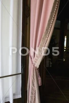 Pink Curtain In A Doorway