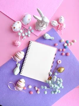 Pink Desktop. Notebook on the table with easter decorations. Stock Photos