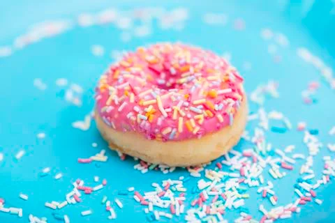 Pink donuts on blue background Stock Photos