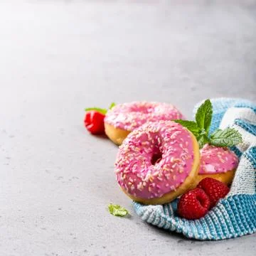 Pink donuts on gray background 스톡 사진