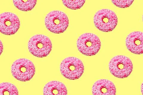 Pink donuts on light yellow background big size Stock Photos