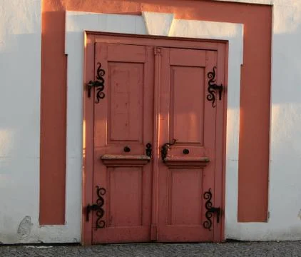 Pink door with ironwork Stock Photos