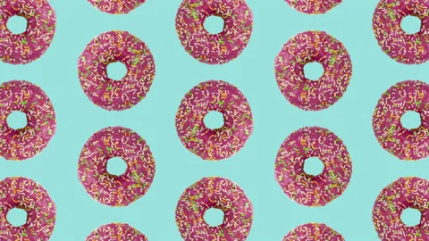 Pink doughnuts seamless pattern on a pale blue background Stock Footage 144209909