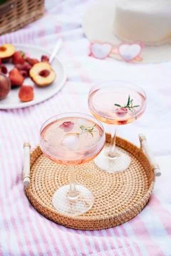 Pink drinks, cocktail with ice, raspberry, rosemary. Two glasses with martini Stock Photos